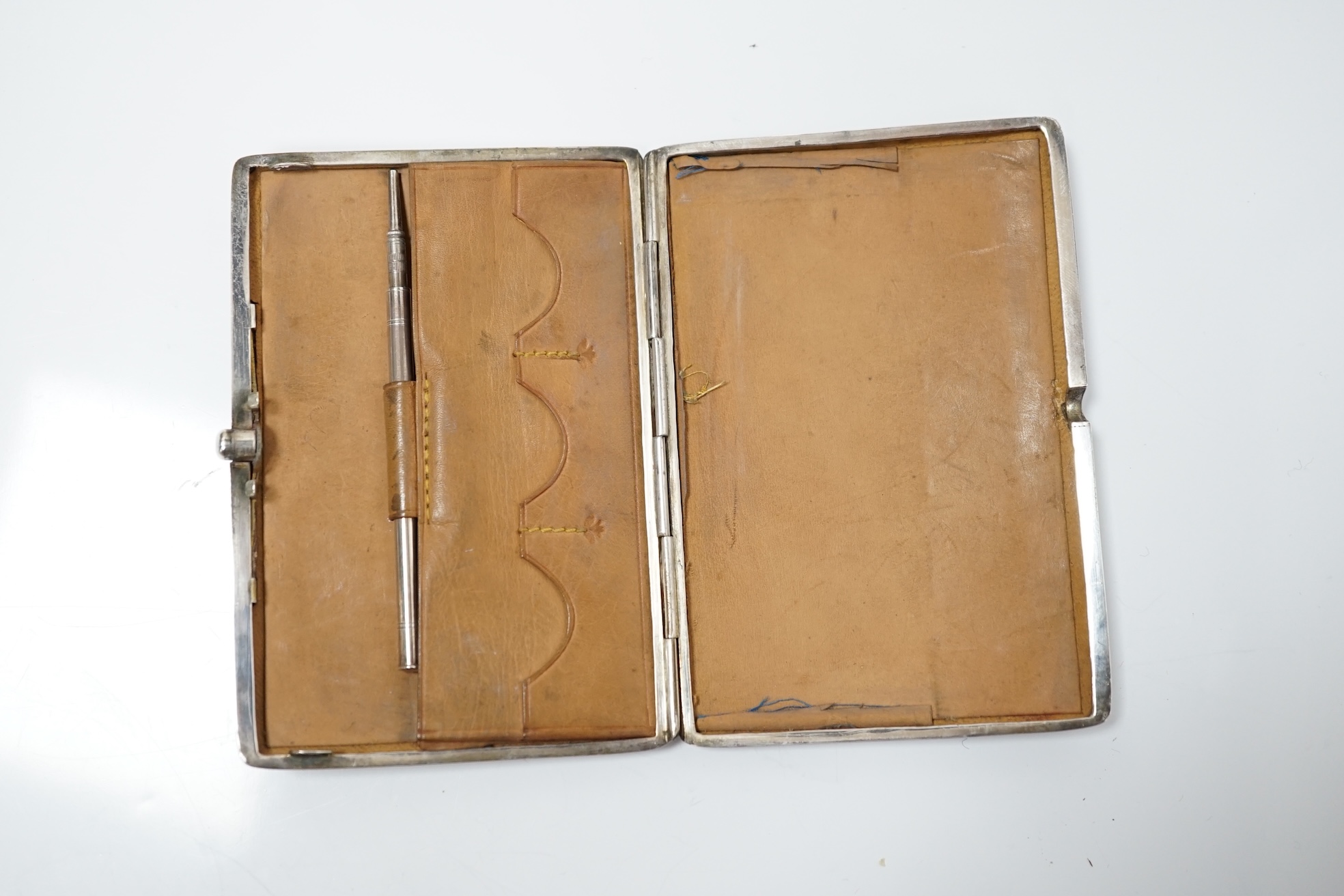 A Victorian engraved silver card purse with pencil and leather interior, Deakin & Francis, Birmingham, 1897, 10.5cm. Condition - good